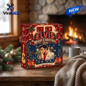 Front view of an Elvis Presley Christmas Advent Calendar on a wooden table near a fireplace.