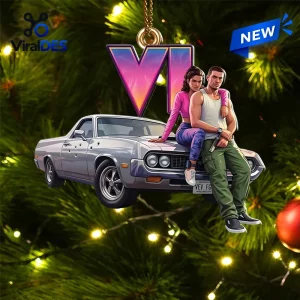 Front view of a Grand Theft Auto VI Car Christmas Ornament hanging on a lit pine tree.