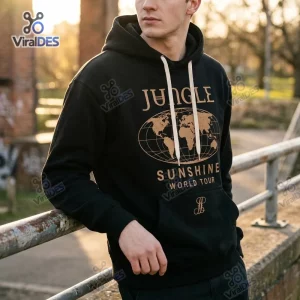 Front view of a person wearing a black Jungle Sunshine World Tour Merchandise Hoodie with gold world map graphic.
