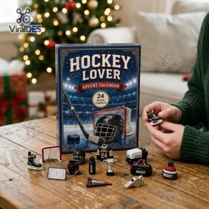 Front view of Hockey Lover Advent Calendar 2026 box with miniature acrylic ornaments on a wooden table.