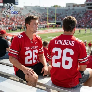 Two people wearing the red Ohio State Buckeyes Tyler Childers 2026 football jersey while sitting in a stadium.