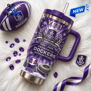 Front view of a purple Fremantle Dockers 32nd Anniversary YETI Tumbler with straw on white fur.