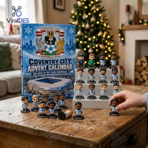 Front view of the Coventry City FC Advent Calendar box and miniature player figurines displayed on a wooden table.