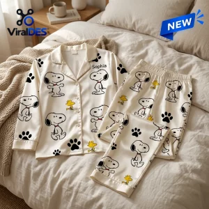 Front view of a personalized satin pajama set featuring cartoon dog prints and paw prints.