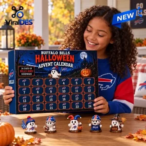 A young girl smiling while holding a Buffalo Bills spooky ghost advent calendar with small ghost figurines on the table.