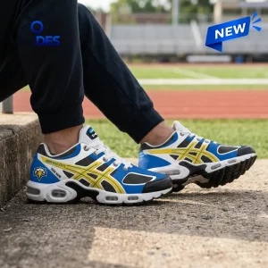 Side view of Morehead State Eagles Custom Air Max Plus Sneakers worn outdoors near a running track.