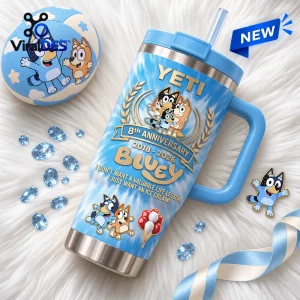 Front view of a blue 40oz Stanley tumbler featuring an 8th anniversary character graphic and handle.