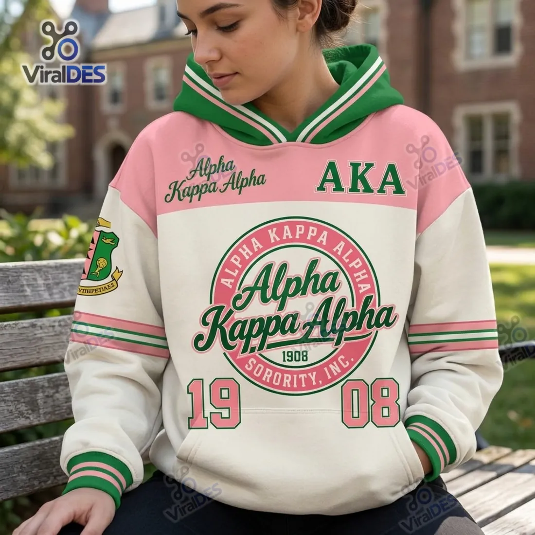 Alpha Kappa Alpha Sorority Hoodie worn outdoors highlighting the striped V-crossover hood, central 1908 seal, and front kangaroo pocket