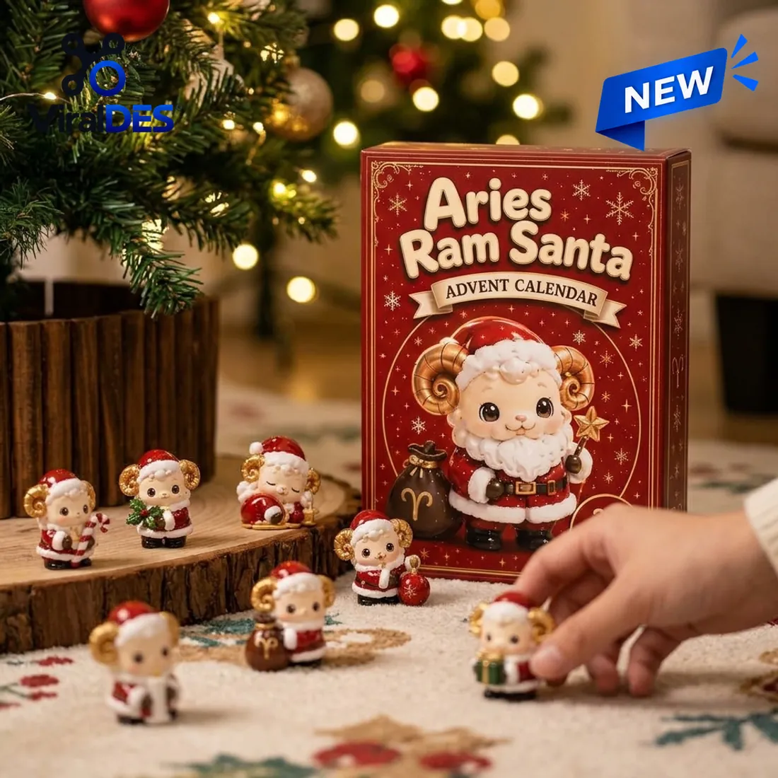Aries Ram Santa Advent Calendar 2026 crimson box beside miniature Aries ram ornaments on a wooden slice under a Christmas tree