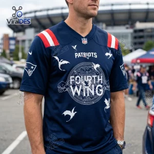 Front view of a blue New England Patriots Fourth Wing football jersey with dragon graphics worn outdoors.