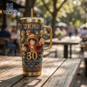 Front view of a gold Stanley tumbler cup featuring anime character graphics and 30 years anniversary text.