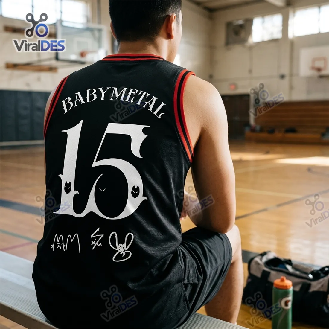 Closer indoor gym bench view of the BABYMETAL World Tour black basketball jersey mesh weave and ribbed shoulder binding