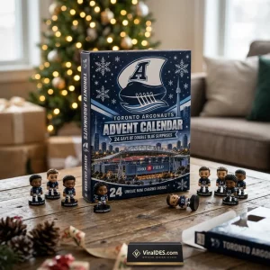 Front view of a Toronto Argonauts 2026 Advent Calendar box on a wooden table with mini figurines.