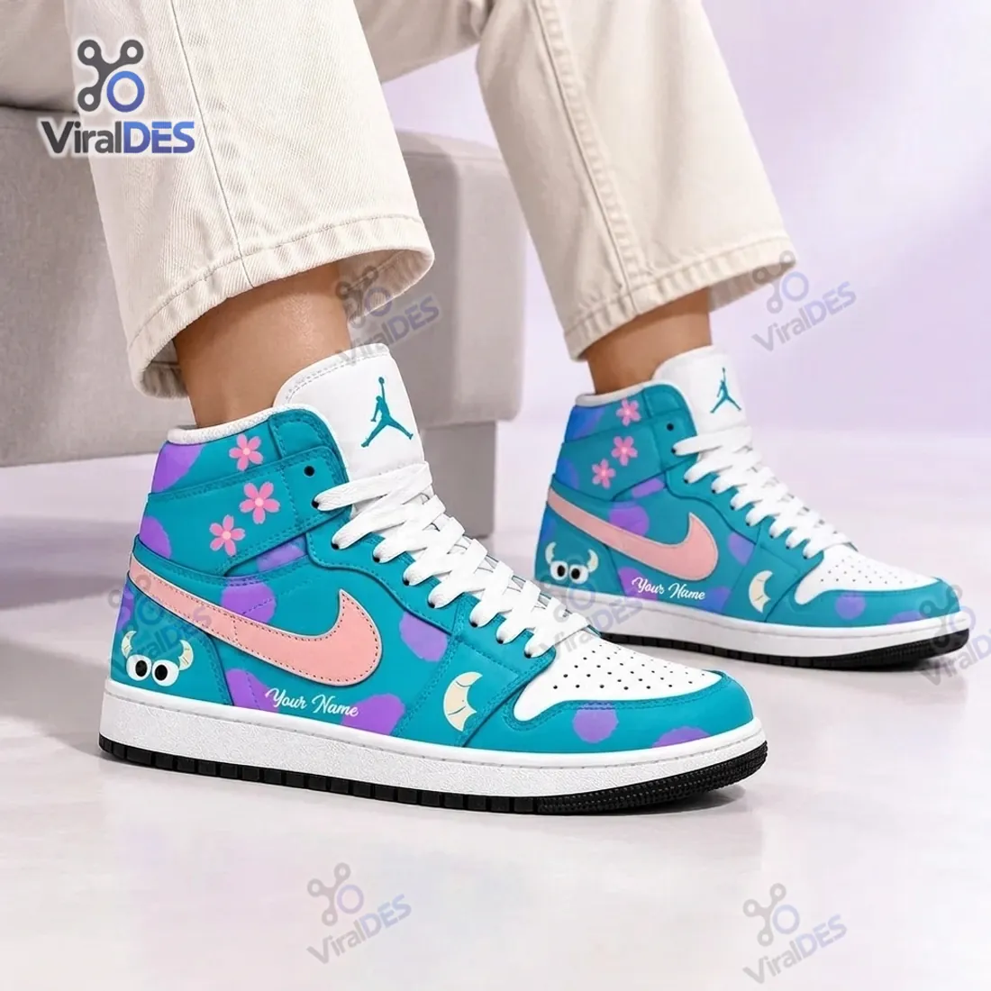 On-foot side profile of the Blue Purple Monster Custom High Top Sneakers displaying the peeking horned monster heel graphic, pink Swoosh, and ankle flowers