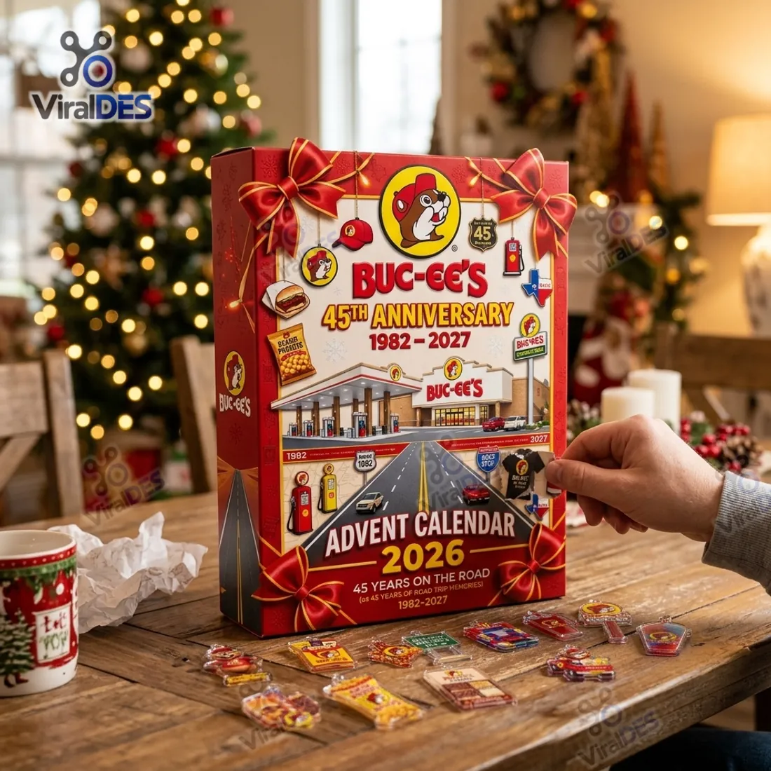 Hand opening a daily compartment on the Buc-ee's 45th Anniversary Advent Calendar 2026 beside flat acrylic ornaments of Beaver Nuggets, fudge, jerky, and car wash