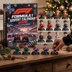Front view of a Formula One 2026 Advent Calendar box alongside miniature racing driver figurines on a wooden table.