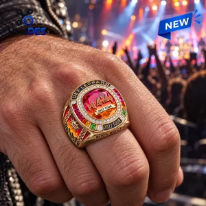 Closeup of the Def Leppard 2027 Tour Championship Ring worn on a hand at a concert venue.
