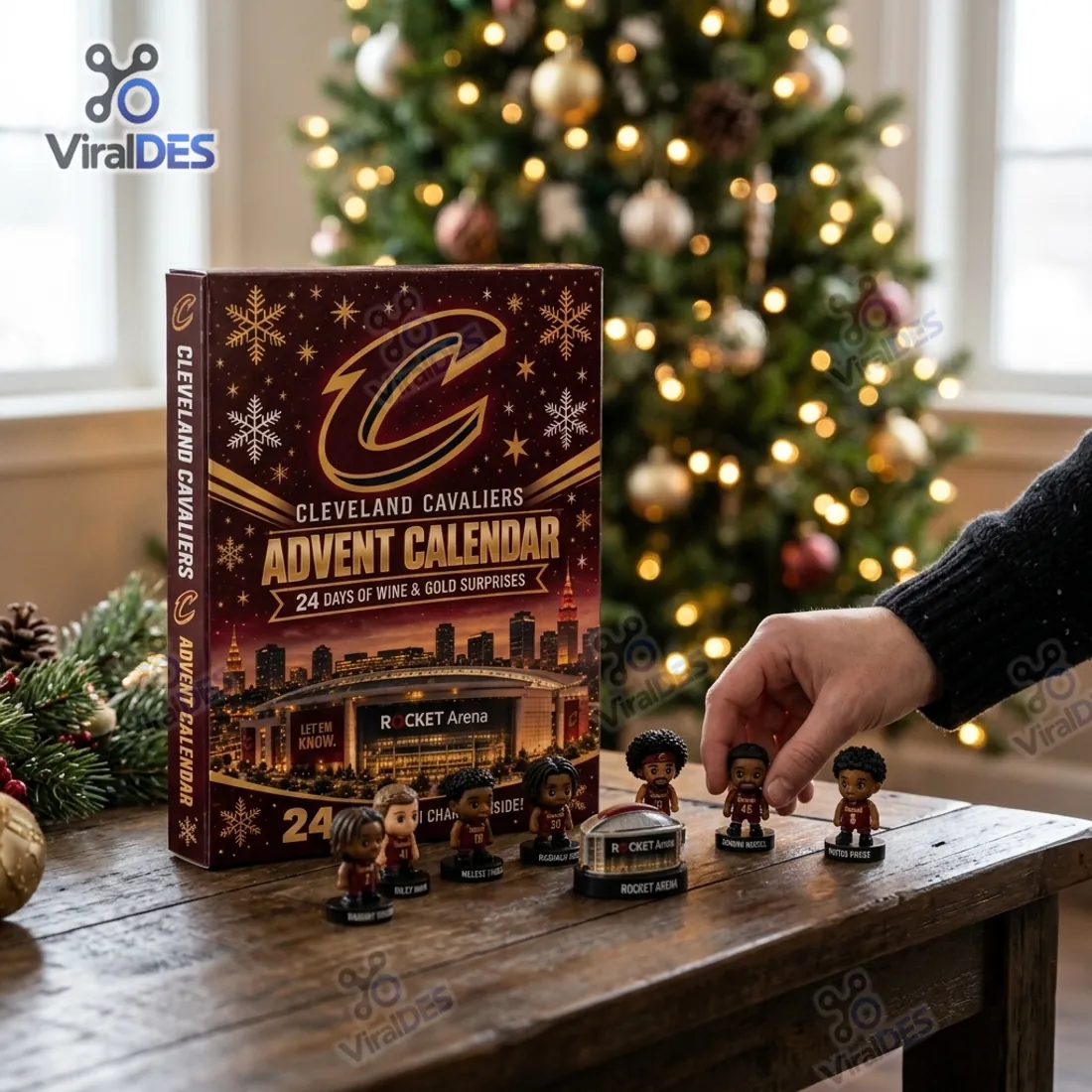 Hand placing freestanding 3D Cleveland Cavaliers miniature player figurines and Rocket Arena replica on a rustic wood table beside the advent calendar box