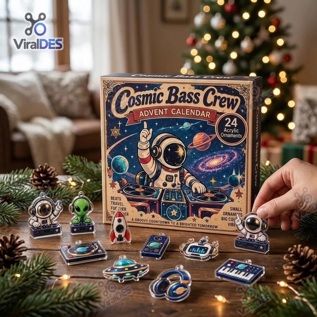Hand holding an astronaut DJ flat acrylic ornament in front of the Cosmic Bass Crew Advent Calendar box and pine branches