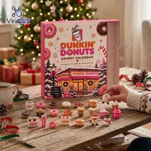Front view of a Dunkin Donuts Christmas Advent Calendar box with miniature food figures displayed on a wooden table.