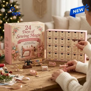 Front view of the Merry Christmas Sewing Magic Advent Calendar box and opened calendar with tiny sewing miniatures on a table.