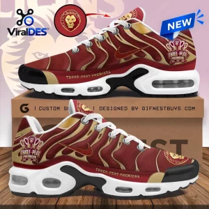 Side view of Brisbane Lions 2026 AFL Premiers Air Max Plus sneakers in maroon and gold.