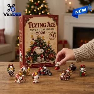 Front view of Peanuts Snoopy Flying Ace 2026 Advent Calendar box with miniature holiday figurines on a table.