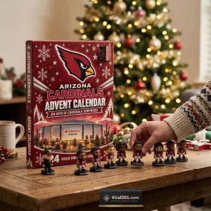 Front view of an Arizona Cardinals 2026 Advent Calendar box on a wooden table with mini figurines.