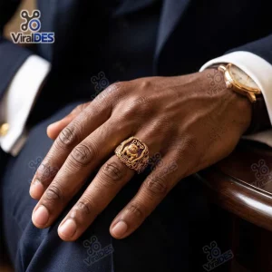 Close-up view of an Omega Psi Phi Gold Bulldog Ring worn on a hand.