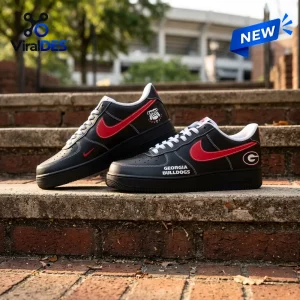 Side view of Georgia Bulldogs Black In Black Air Force 1 Sneaker placed on outdoor stone steps.