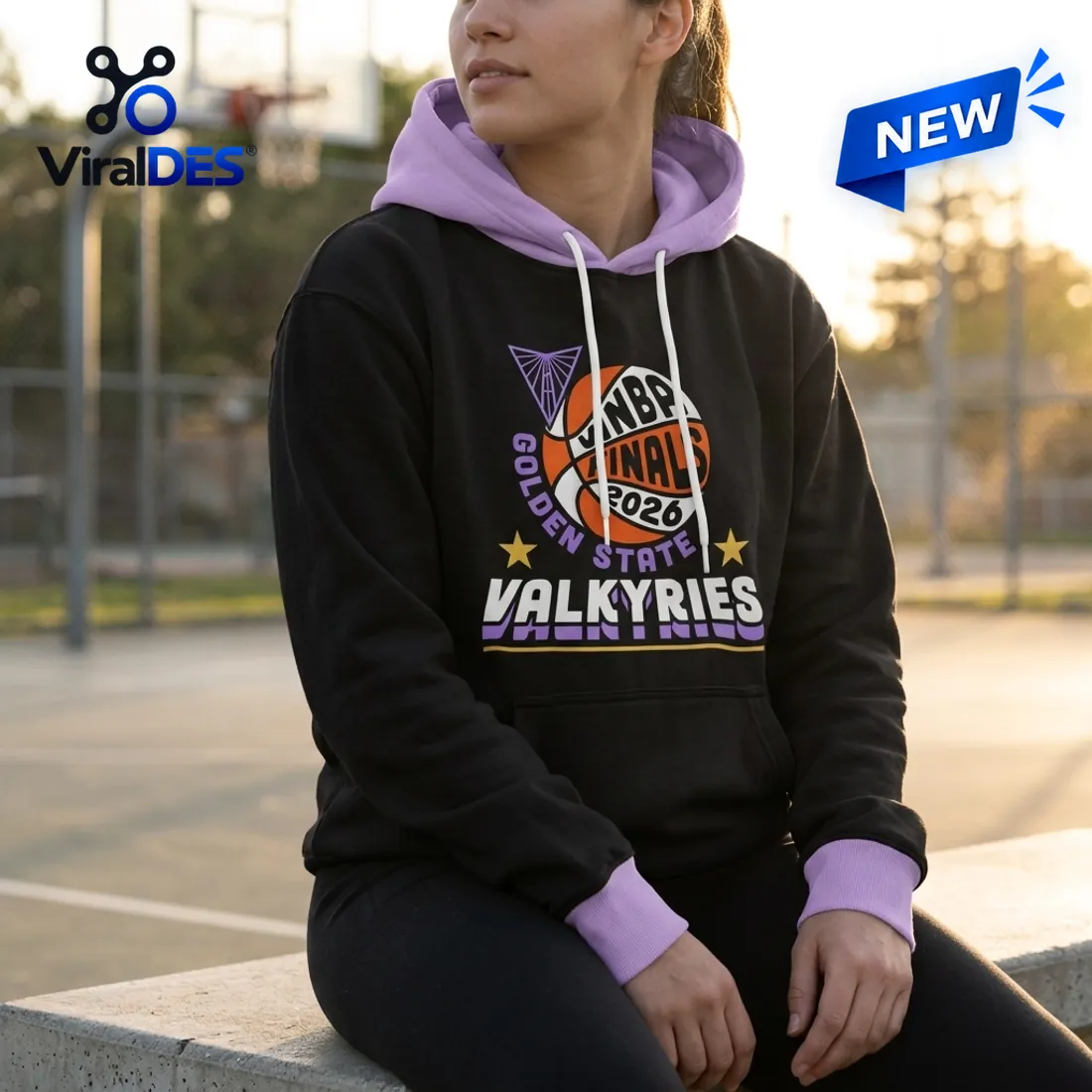 Courtside view of the Golden State Valkyries 2026 WNBA Finals Pullover displaying the orange-and-white WNBA Finals 2026 basketball emblem, Bay Bridge triangle, and lavender hood
