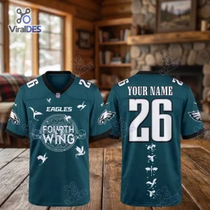 Front and back view of a teal Philadelphia Eagles Fourth Wing football jersey featuring dragon graphics.