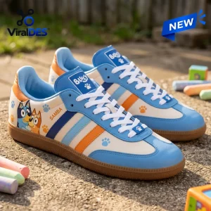 Side view of Bluey And Bingo Blue Samba Shoes with white laces and orange stripes.