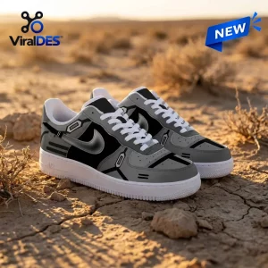 Side angle of Star Wars Mandalorian Air Force 1 Sneaker on cracked desert ground.