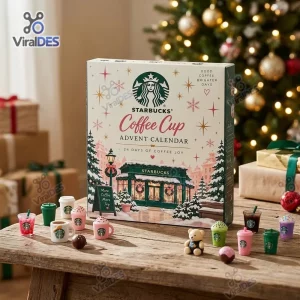 Front view of a Starbucks Coffee Cup Advent Calendar 2026 with miniature cups on a wooden table.
