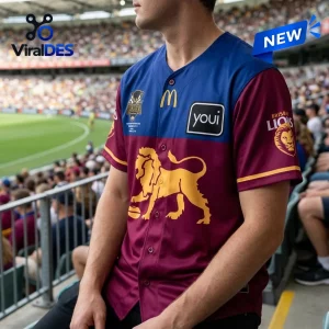 Man wearing Brisbane Lions 2026 AFL Premiers baseball jersey at stadium.