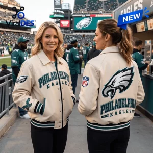 Front and back views of a woman wearing a cream varsity jacket with team graphics at a stadium.