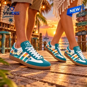 Lifestyle view of Jimmy Buffett Parrothead Teal Samba Shoes worn on a wooden boardwalk at sunset.