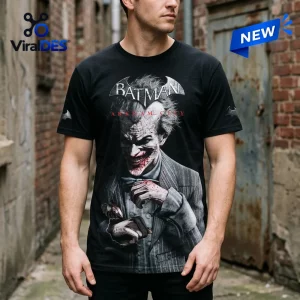 Front view of a black Batman Arkham City 15th Anniversary T-Shirt featuring a grinning character graphic.
