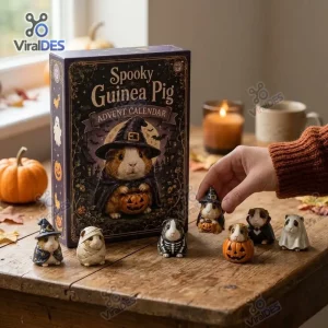 Hand holding a guinea pig figurine next to the Spooky Guinea Pig Halloween Countdown Advent Calendar box.