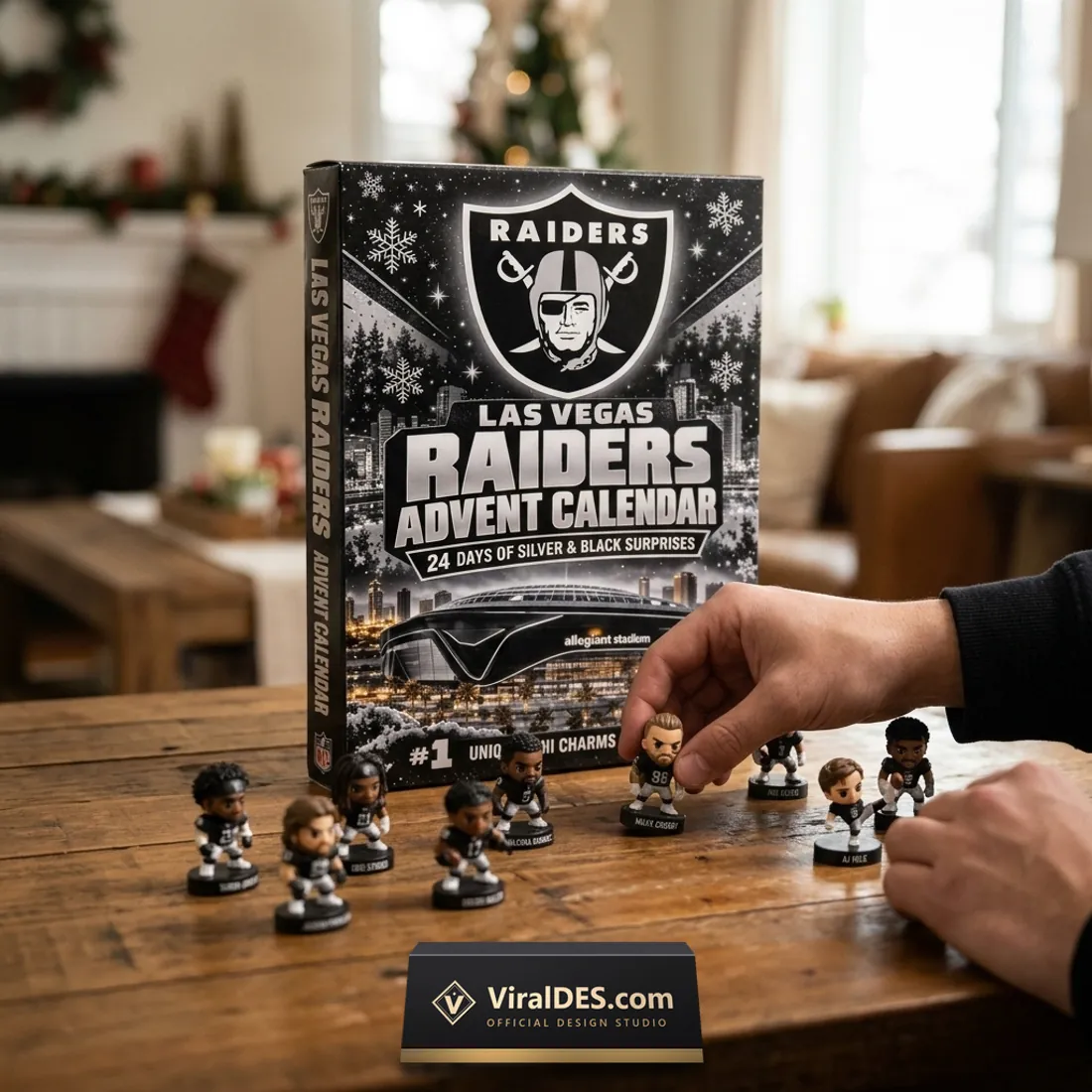 Collector placing #98 Maxx Crosby and #6 AJ Cole miniature figurines on a wooden table in front of the Las Vegas Raiders Advent Calendar 2026