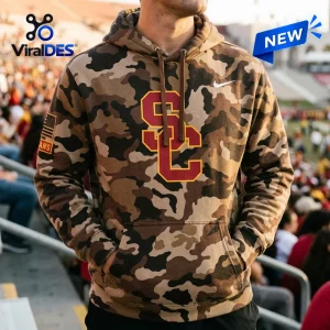 Front view of a USC Trojans Military Appreciation Camo Hoodie worn outdoors at a stadium.
