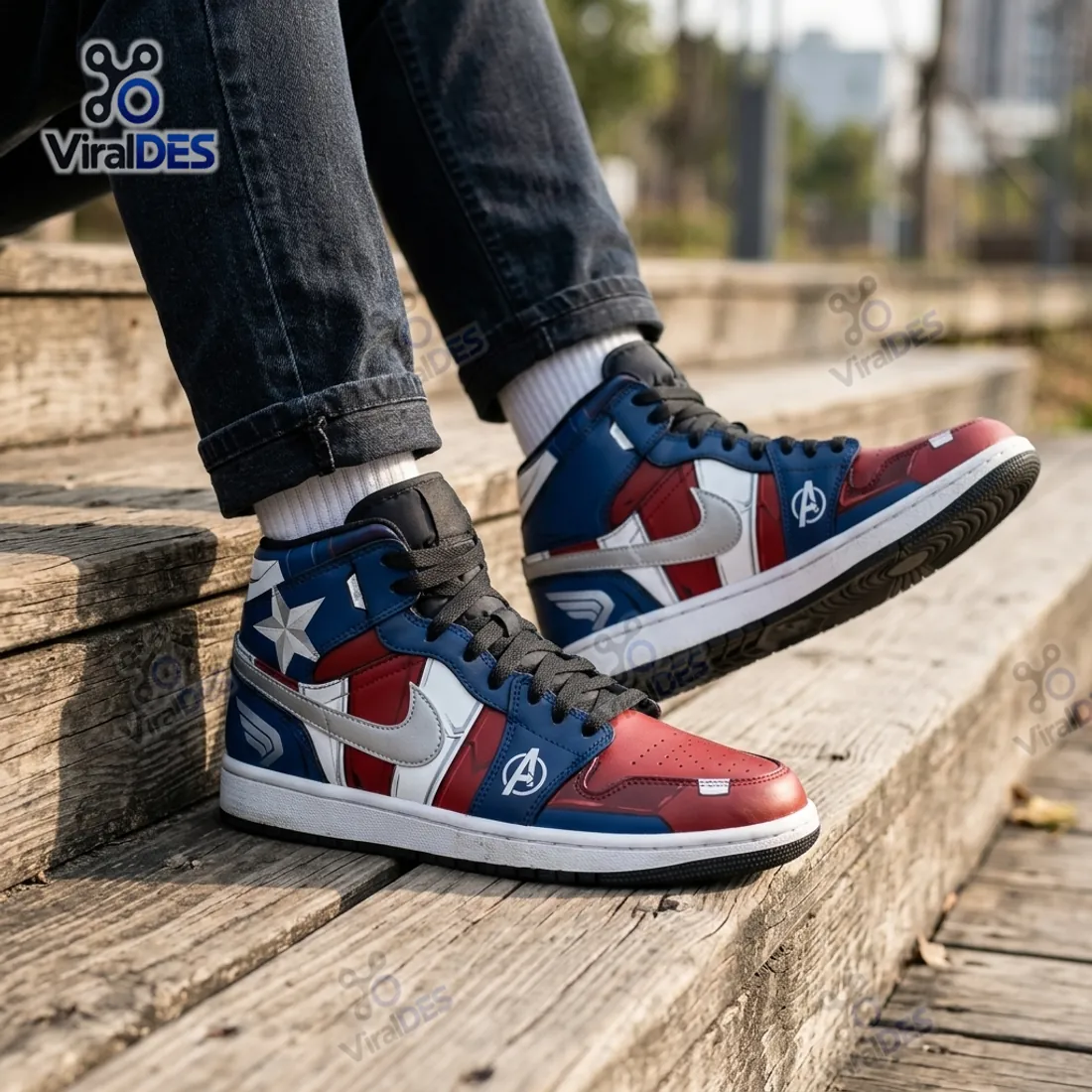 On-foot view of the Marvel Captain America Air Jordan 1 High Top Sneakers worn with black denim jeans on wooden steps