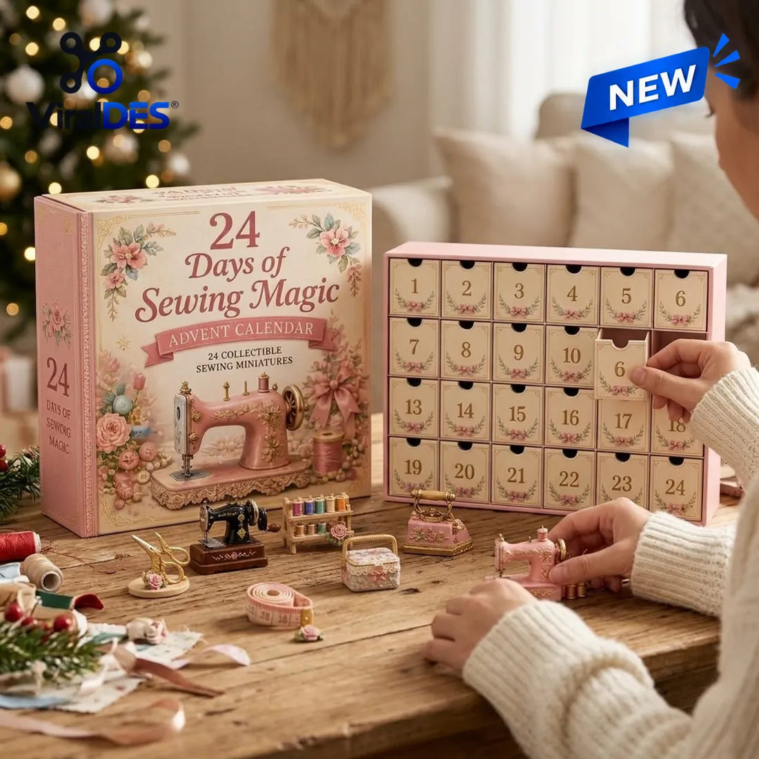 Hands pulling open drawer 6 of the 24 Days of Sewing Magic Advent Calendar cabinet on a wooden craft table beside miniature sewing machines, thread rack, and stork scissors