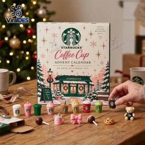 Front view of the Starbucks Coffee Cup Advent Calendar 2026 with miniature cups arranged on a wooden table.