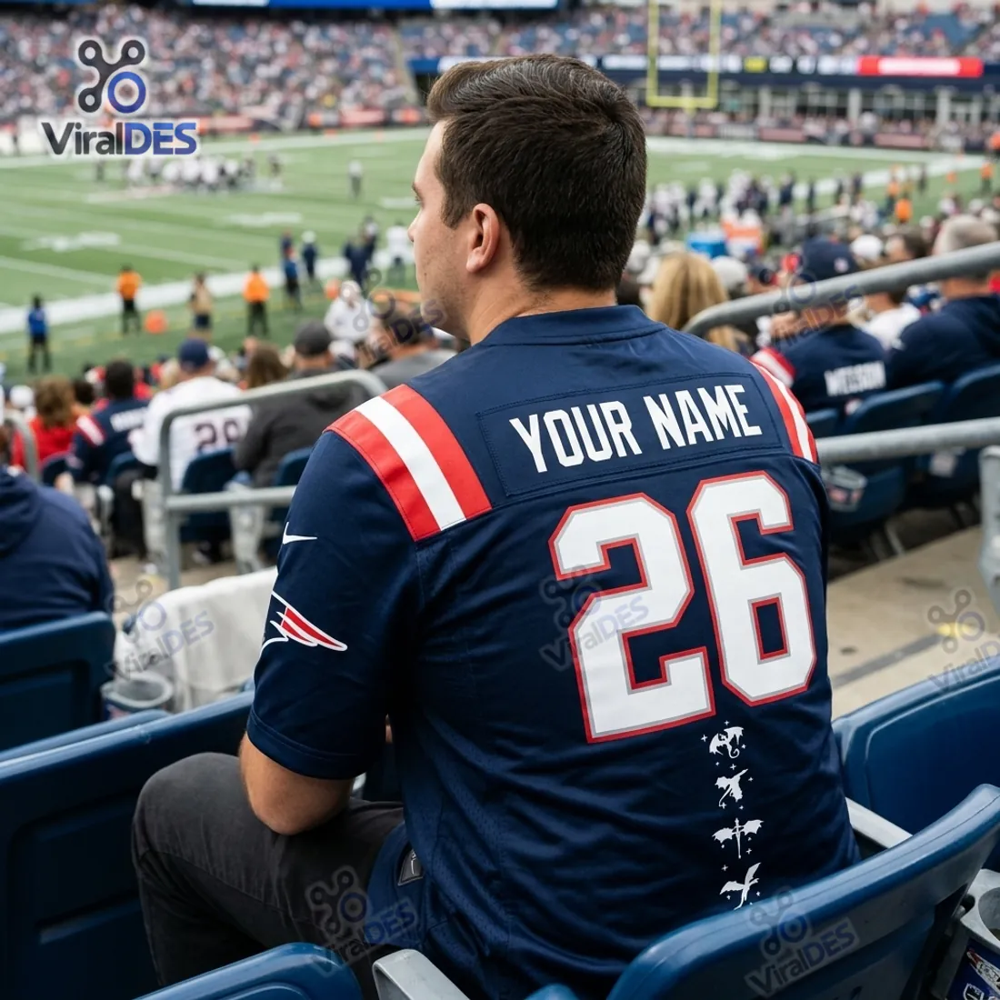 Rear view of the New England Patriots Fourth Wing Football Jersey in stadium seats with custom nameplate, number 26, and vertical dragon column