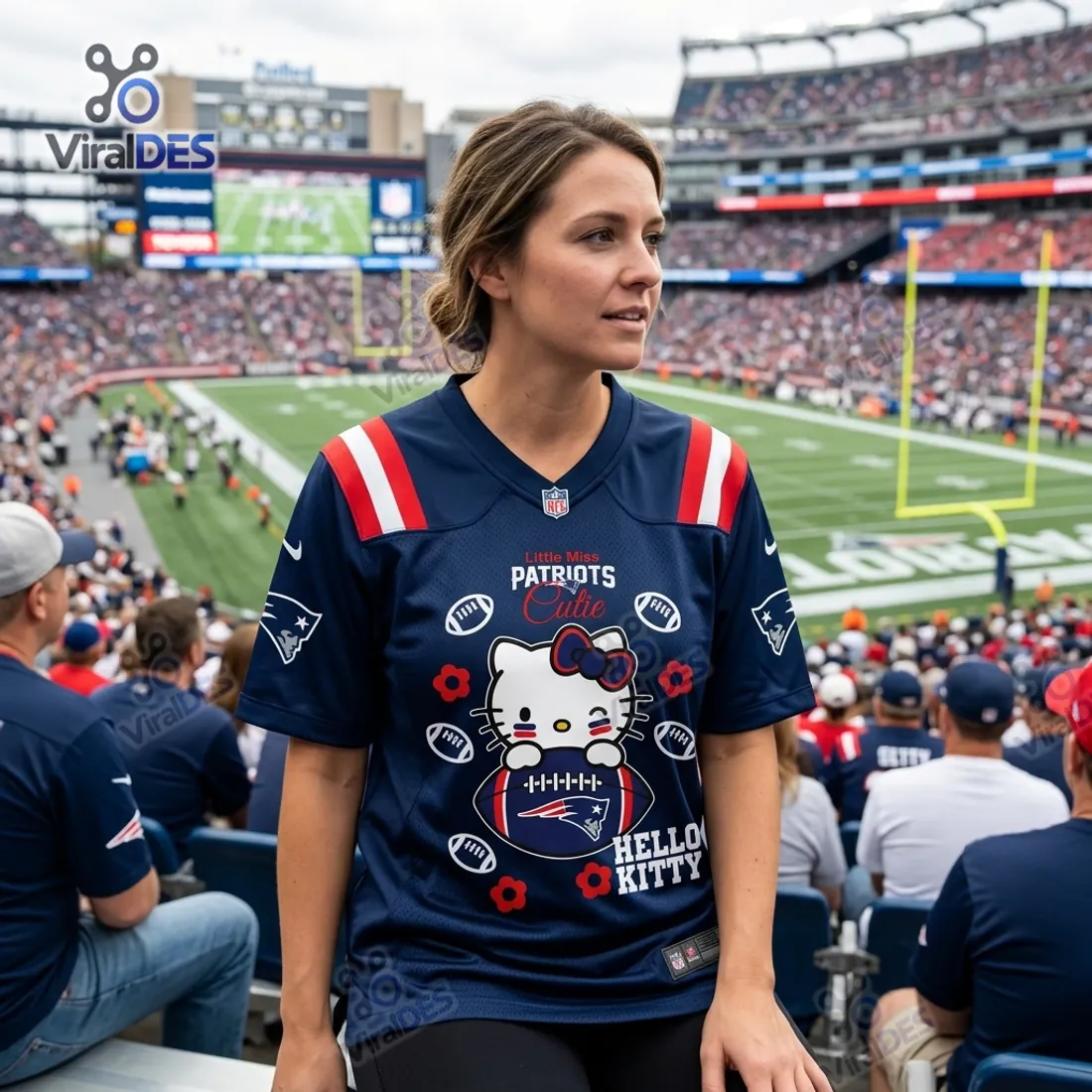 Supporter seated in stadium stands wearing the New England Patriots Hello Kitty Personalized Football Jersey