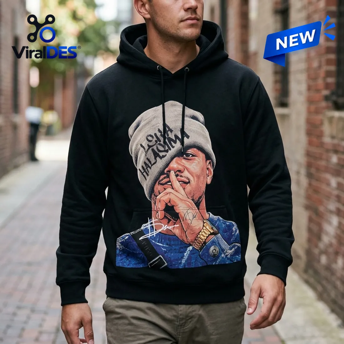 Front view of the New Zealand Warriors Leka Halasima Black Hoodie displaying the illustrated shush portrait and beanie lettering