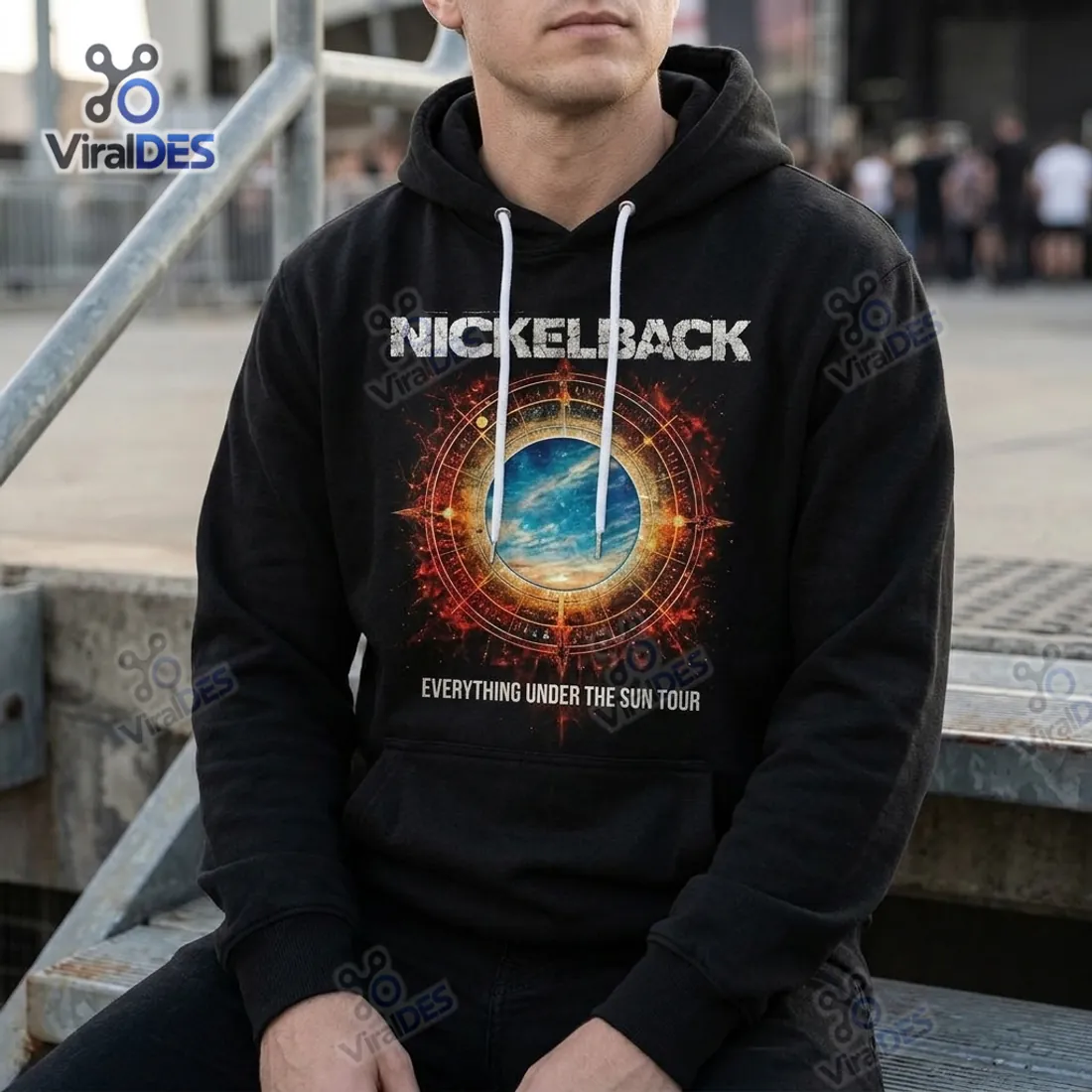 Close-up of the Nickelback Everything Under The Sun Black Hoodie showing the fiery solar compass chest graphic and white drawstrings