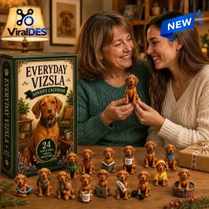 Two smiling women holding a miniature dog figurine alongside the Everyday Vizsla Dog Advent Calendar 2026 box.